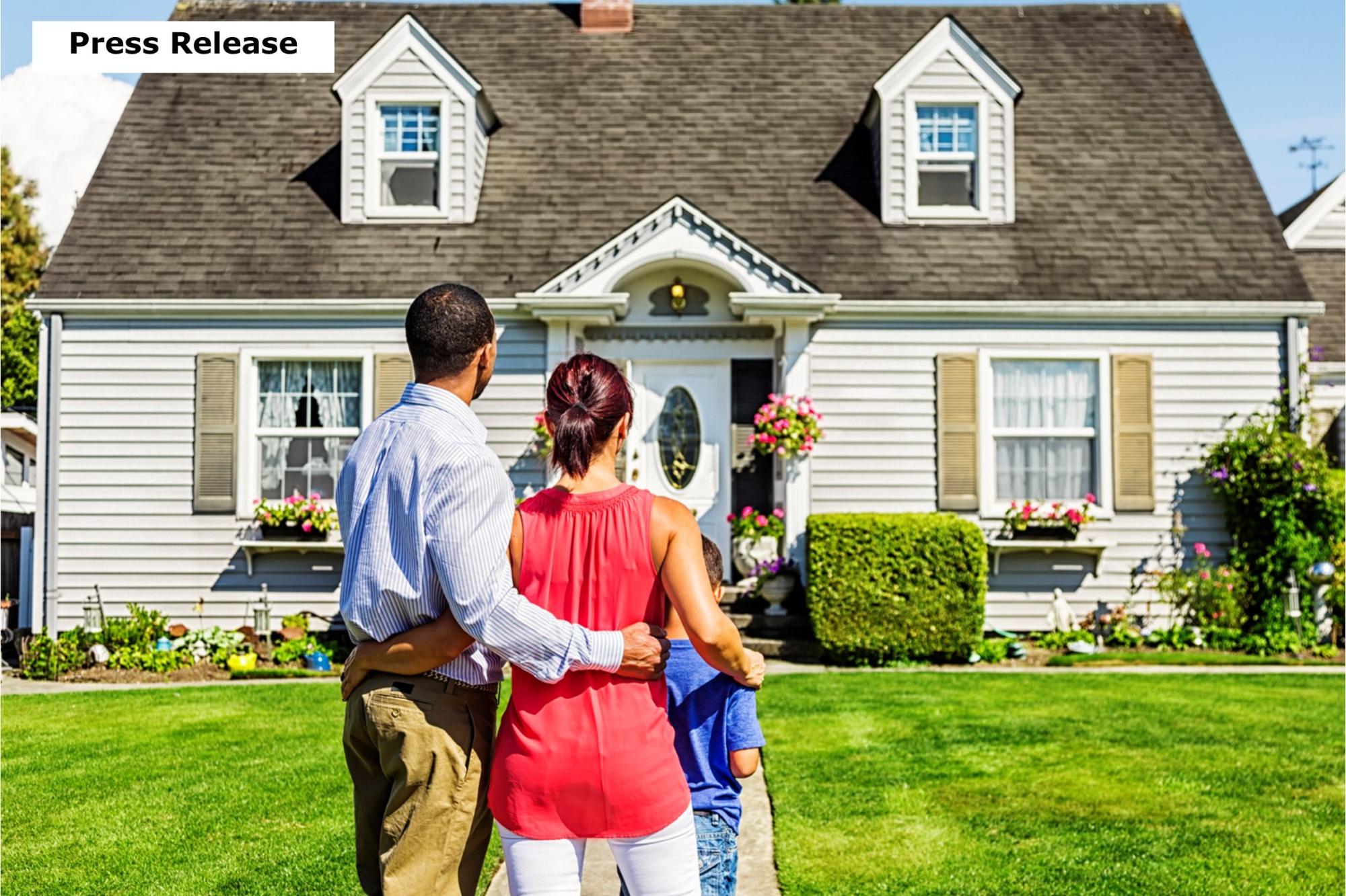 Press Release Family looking at front of house