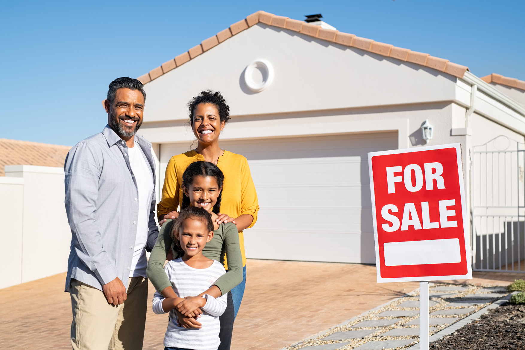 A picture of a family of four buying a home