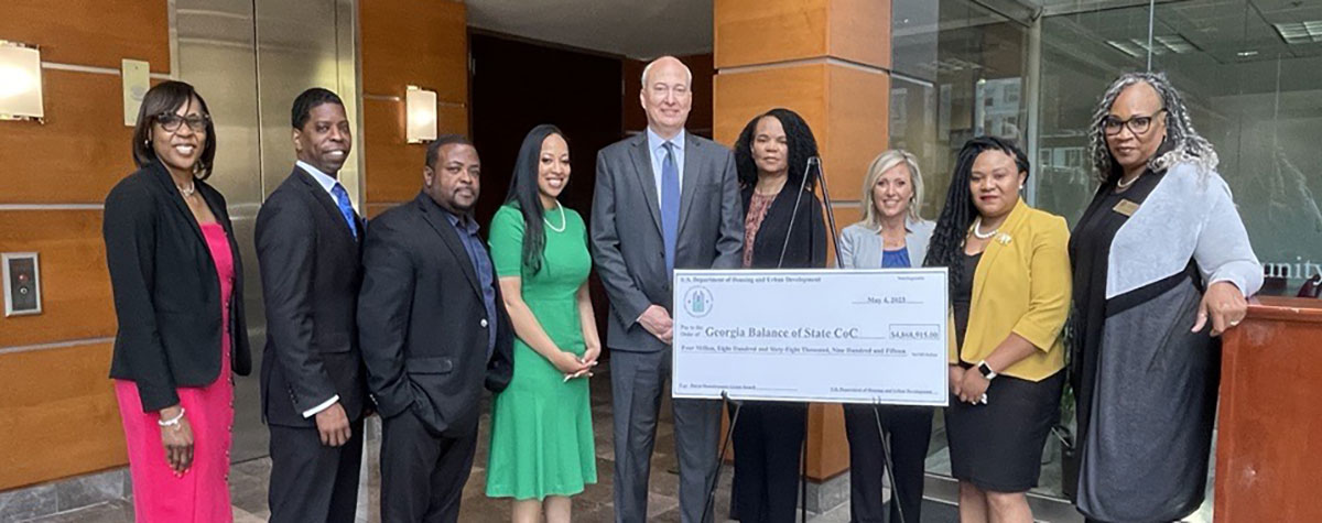 [HUD Deputy Regional Administrator Tiffany Cobb, Georgia Field Office Director Shea Johnson, Community Planning & Development Director Adrian Fields present check to the Georgia Balance of State Continuum Care]