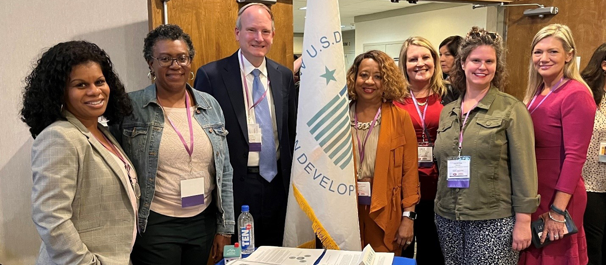 [Kentucky and Tennessee HUD Region IV teammates joined forces to share the latest information on HUD Programs with PHA professionals at the Kentucky Housing Association/Tennessee Association of Housing and Redevelopment Authorities annual training conference. Pictured (l to r) from Tennessee: Tajuanya Carr, Calin Goolsby, Walter Perry, and Demetria Daniel; and from Kentucky: Emelie Lima-Alguire, Kristina Messina, and Kimberly Gillis.]. 